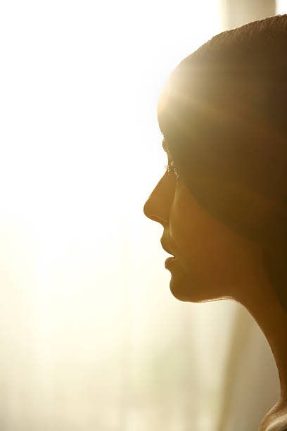 istock Profile of woman looking towards the light 165776750