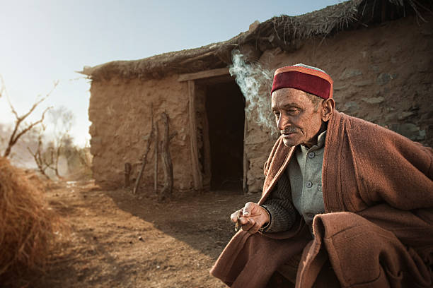 istock Real people from rural India: Senior man smoking Bidi 165780107