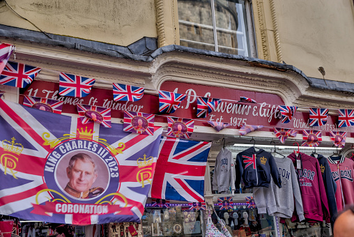 Windsor, UK - July 29, 2023: Festive streets with British flags strung above adjacent to Windsor Castle