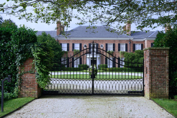 Long Island, NY - August 2023:  A mansion protected by a gate for privacy