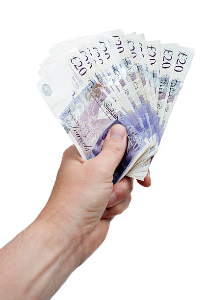 Handy Cash Hand With Twenty Pound Notes british currency stock pictures, royalty-free photos & images