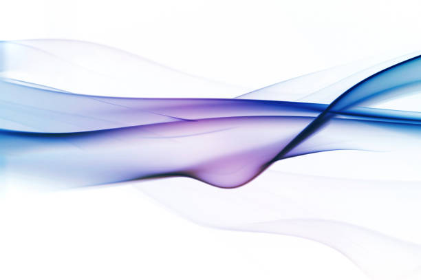 Delicate blue smoke swirls gracefully against a dark background, creating an abstract and ethereal visual effect with fluid motion.