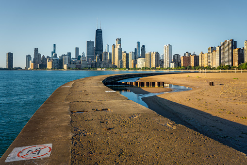 View of the beachfront, Lake Michigan and the silhouette of buildings in Downtown Chicago
