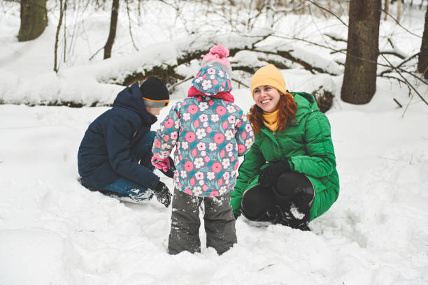 istock family walking in the winter forest 1657863507