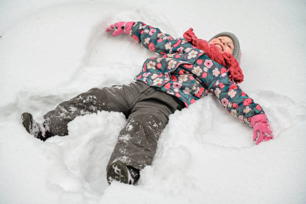 istock girl walking in the winter forest 1657864012