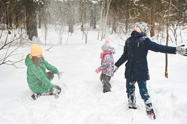 istock family walking in the winter forest 1657868092