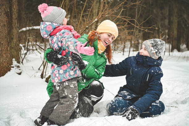 istock family walking in the winter forest 1657878036