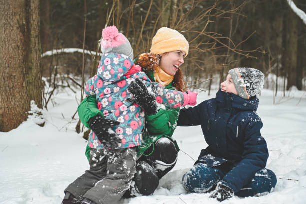 istock family walking in the winter forest 1657878037