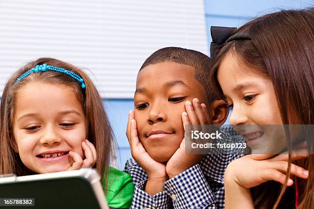 Multiethnic Elementary 7yearold Children Digital Tablet School Education Technology Stock Photo - Download Image Now