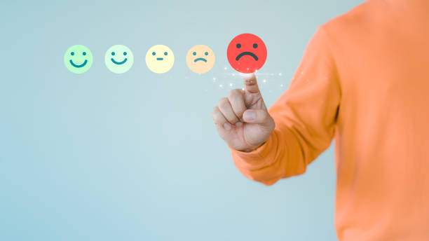 istock Customer hand touching the virtual screen on the angry emotion face. Assessment testimonial review for dislike service and low quality. Business concept of customer experience dissatisfied. 1657888994