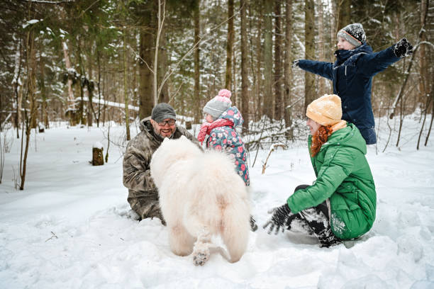 istock family walking in the winter forest 1657897861