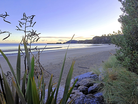 Coastal scene at Pohara is a warm, safe and sandy beach in Golden Bay, north of the Abel Tasman National Park and just 10 minutes from the Takaka township.