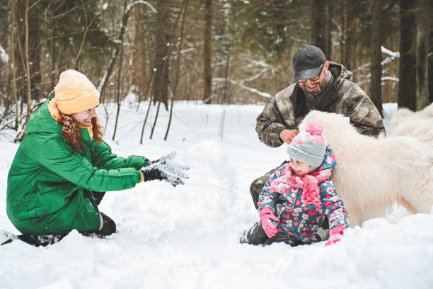 istock family walking in the winter forest 1657905246