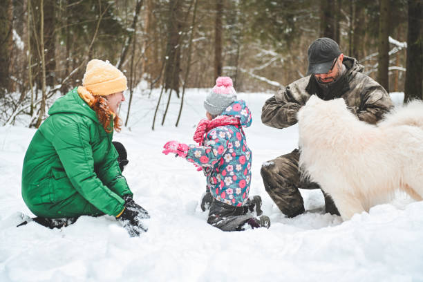 istock family walking in the winter forest 1657905737
