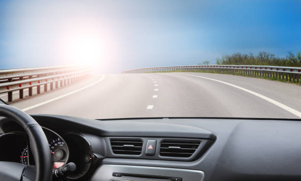 istock View from the windshield of a car driving along road 1657967641