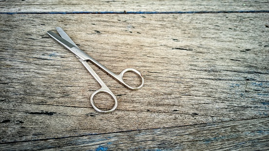 a pair of scissors on a board