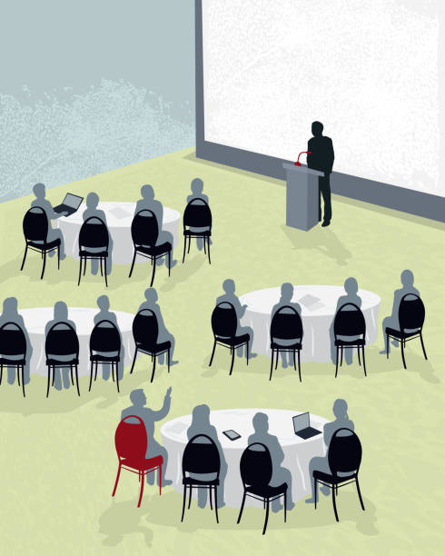 Round table conference with speaker Vector illustration of a conference with speaker at podium in front of large blank screen. Audience sits at banquet tables with laptops and hand-held devices. Audience member with red chair raising hand to depict Q&A. Download includes Illustrator 8 eps, high resolution jpg and png file. See my portfolio for other similar conference concepts. banquet chairs stock illustrations