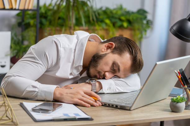 istock Bored sleepy business man worker working on laptop computer, yawning, falling asleep at home office 1658001835
