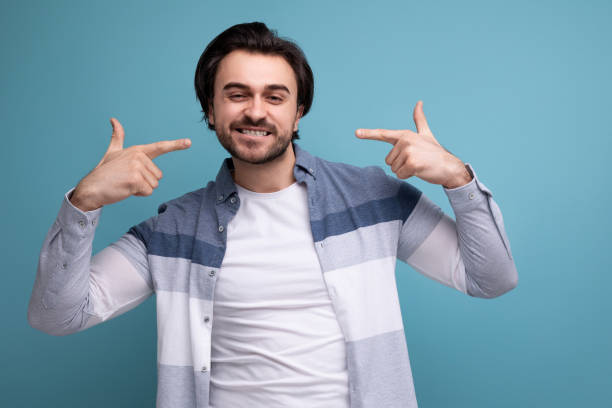 istock portrait of a well-groomed young brunette man on a studio background 1658007796