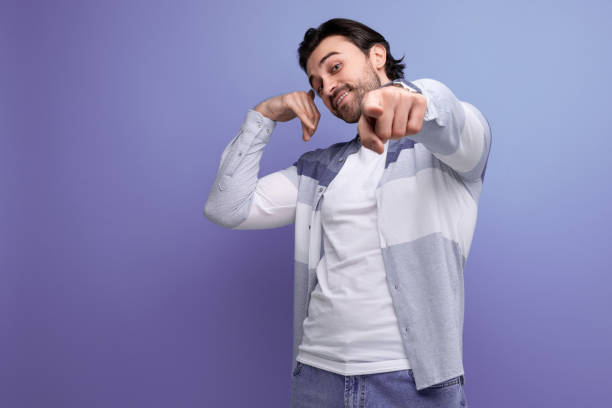 istock stylish brunette man in a model appearance and a cool hairstyle 1658007797