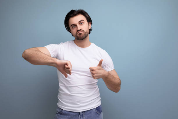 istock upset young man in white t-shirt on studio background with copyspace 1658008332