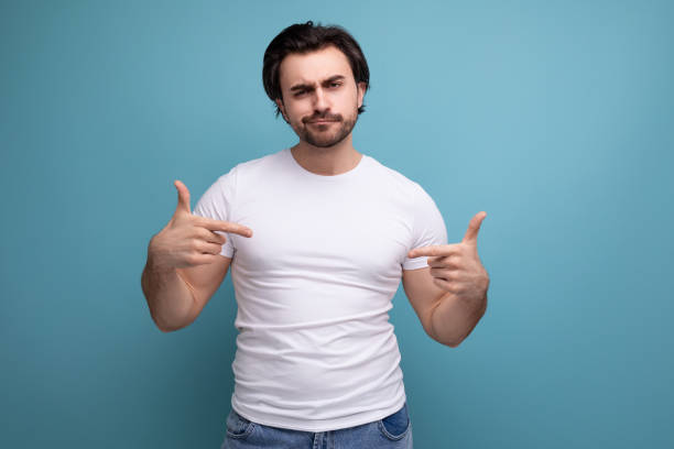 istock strong muscular young man in white t-shirt on studio background with copyspace 1658008339