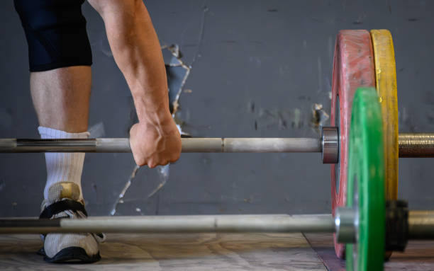 Olympic Weightlfiting A weightlifter lifts on an Olympic style platform. clean and jerk stock pictures, royalty-free photos & images