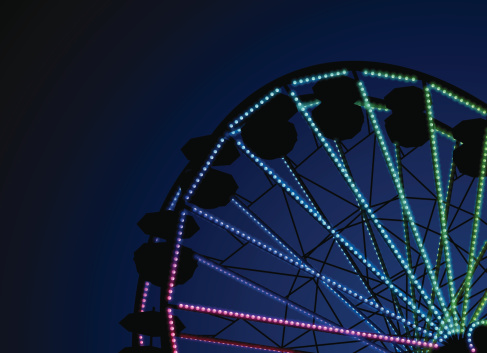 Detailed night ferris wheel background with copy space.