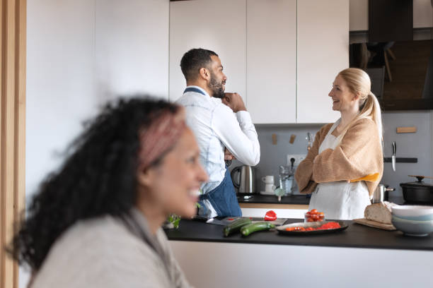 istock Friends prepare and cook lunch 1658043601