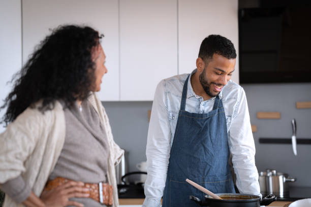 istock Friends prepare and cook lunch 1658043606