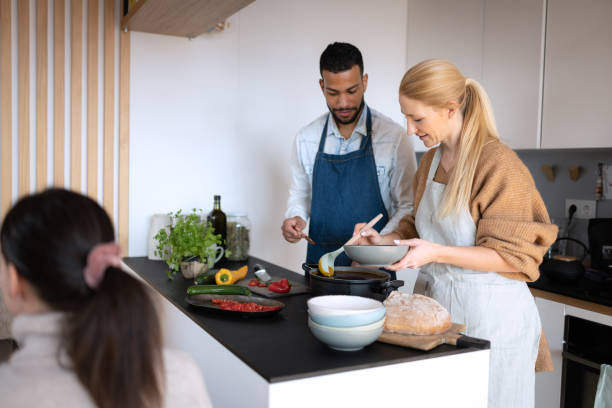 istock Friends prepare and cook lunch 1658044132