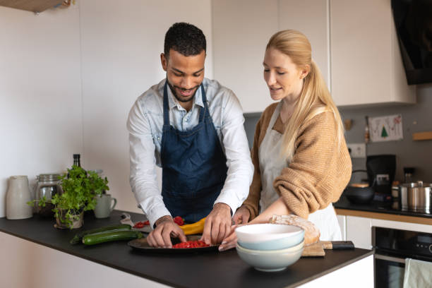 istock Friends prepare and cook lunch 1658044140