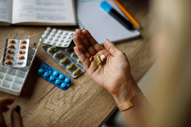 istock Young woman taking her medication 1658054844