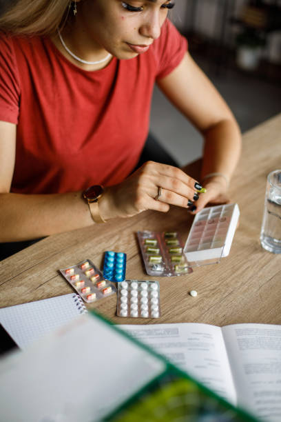 istock Young woman taking her medication 1658054881