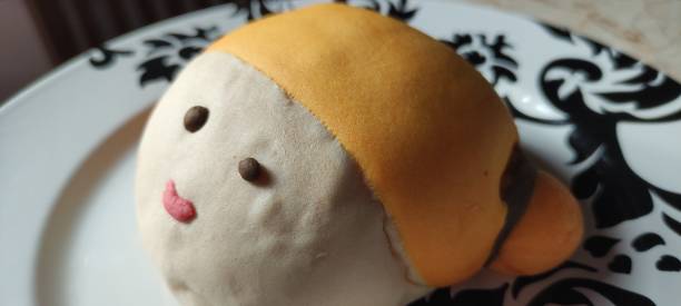 istock close up of cute doll character bread on a plate 1658060935