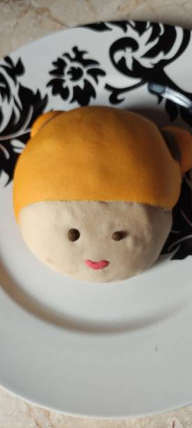 istock close up of cute doll character bread on a plate 1658060950
