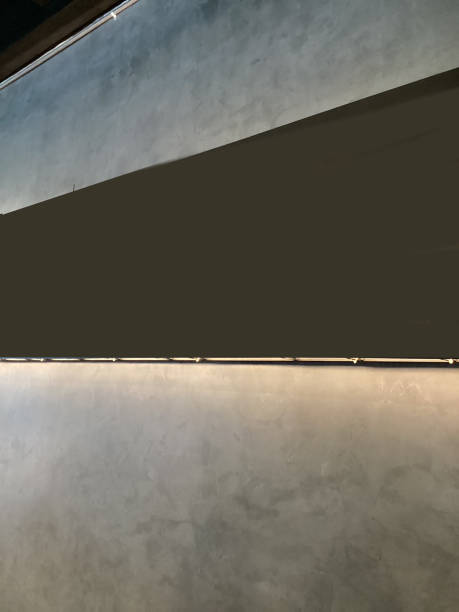istock grey color cement wall lighting decorate 1658062025