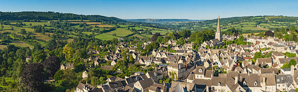 istock Aerial view over pretty country village patchwork landscape 165807519