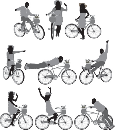 Silhouette of people with bicycles