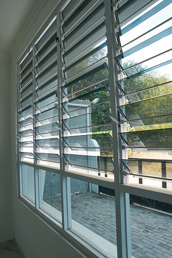 Jalousie windows, sometimes called awning windows, are composed of glass set parallel in a frame.