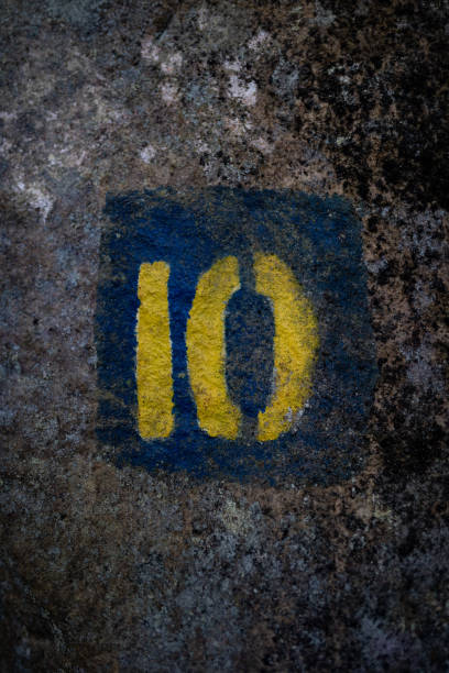 istock A blue and yellow sign on a rock surface 1658127459
