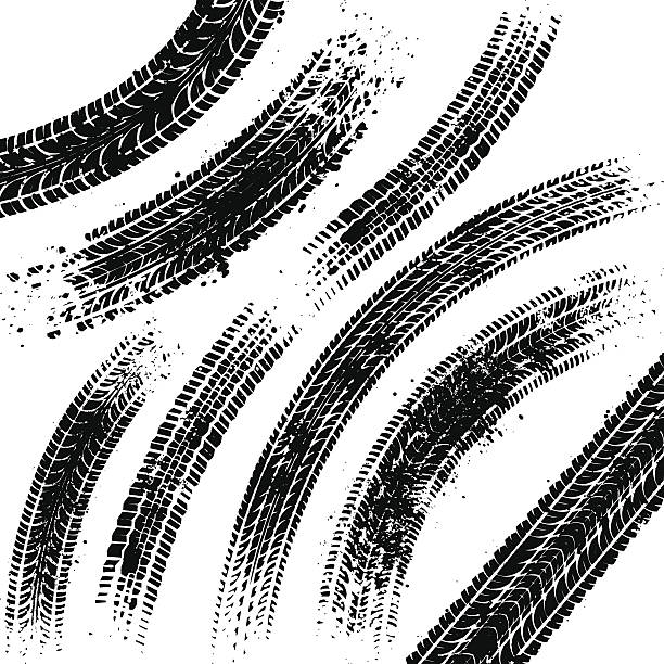 Curved black tyre tracks with grunge splatters.