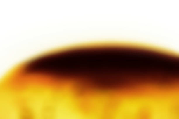 istock Abstract image on a white background with a pudding-like bokeh texture topped with burnt caramel. 1658215244