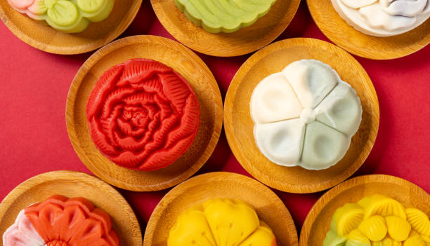 istock top view trendy different flower shapes mooncakes on red horizontal composition 1658221106