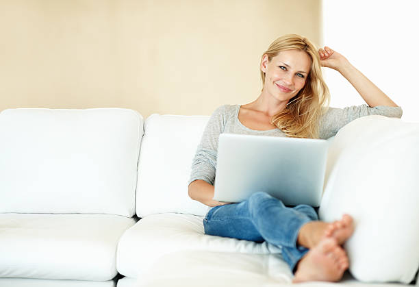 istock Woman with a laptop at home 165823720