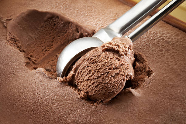 ice cream scoop Chocolate ice cream ball scoop shape stock pictures, royalty-free photos & images