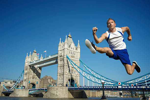 sportler hürden tower bridge, london - hurdle people england tower bridge stock-fotos und bilder