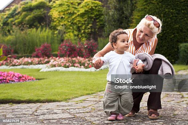 Grandmother And Granddaughter Enjoying Time In Park Stock Photo - Download Image Now