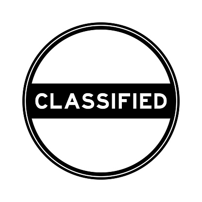 Black color round seal sticker in word classified on white background
