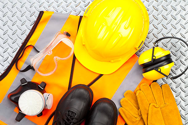Personal protective workwear shoot from above on diamondplate background stock photo